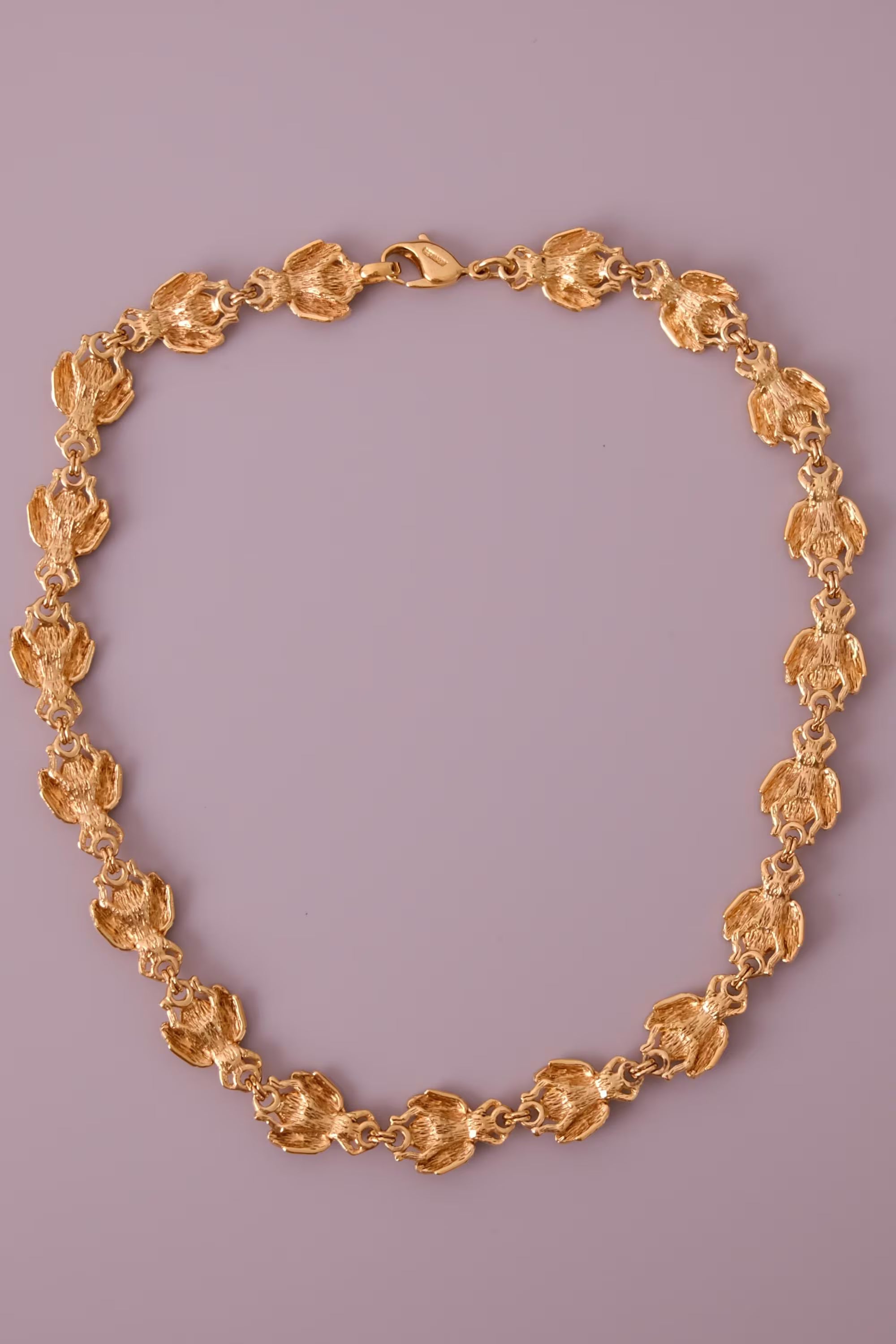 Vintage Christian Dior gold-tone necklace featuring 19 sculptural bee motifs, signed Dior Germany
