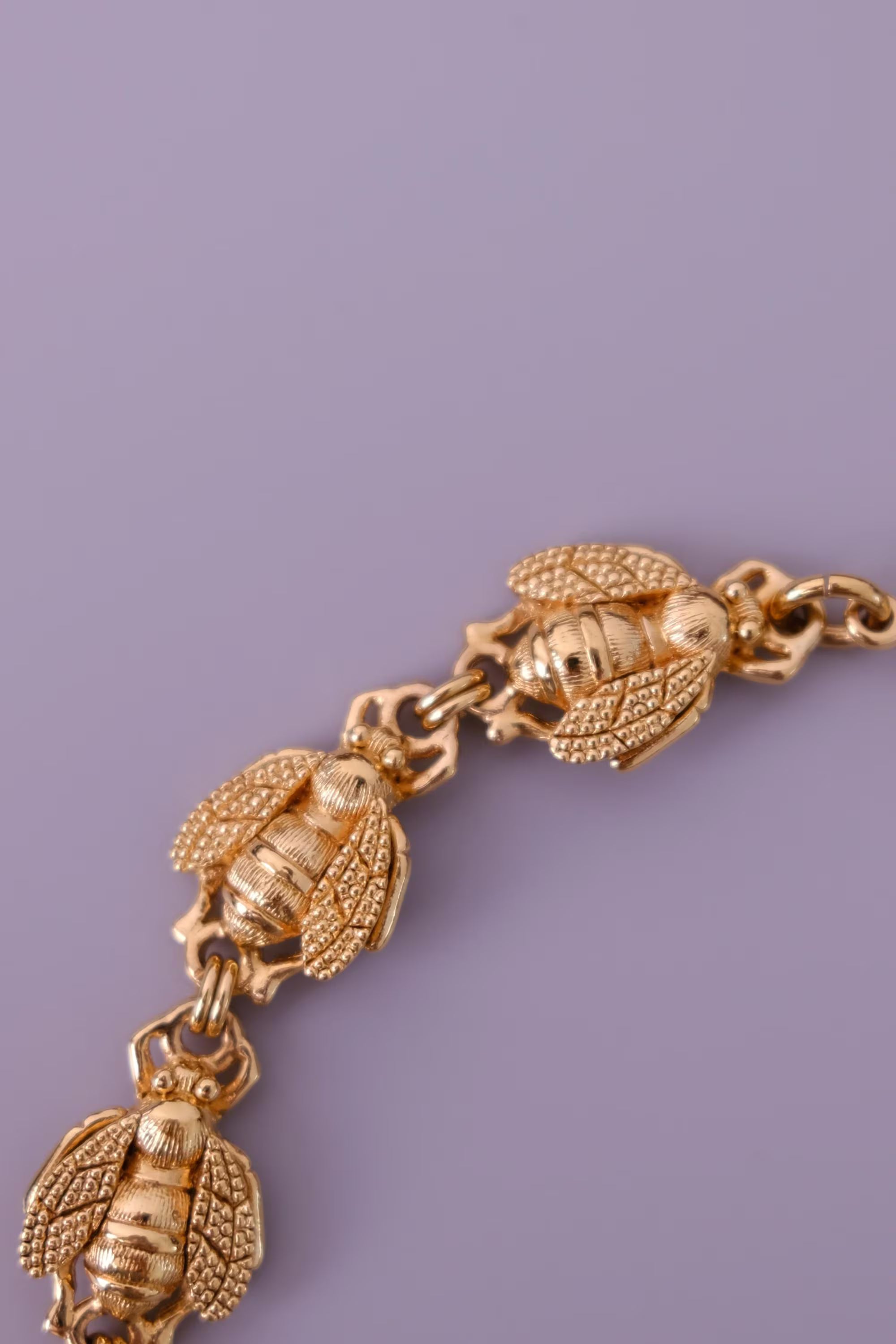 Vintage Christian Dior gold-tone necklace featuring 19 sculptural bee motifs, signed Dior Germany