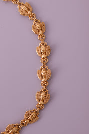 Vintage Christian Dior gold-tone necklace featuring 19 sculptural bee motifs, signed Dior Germany