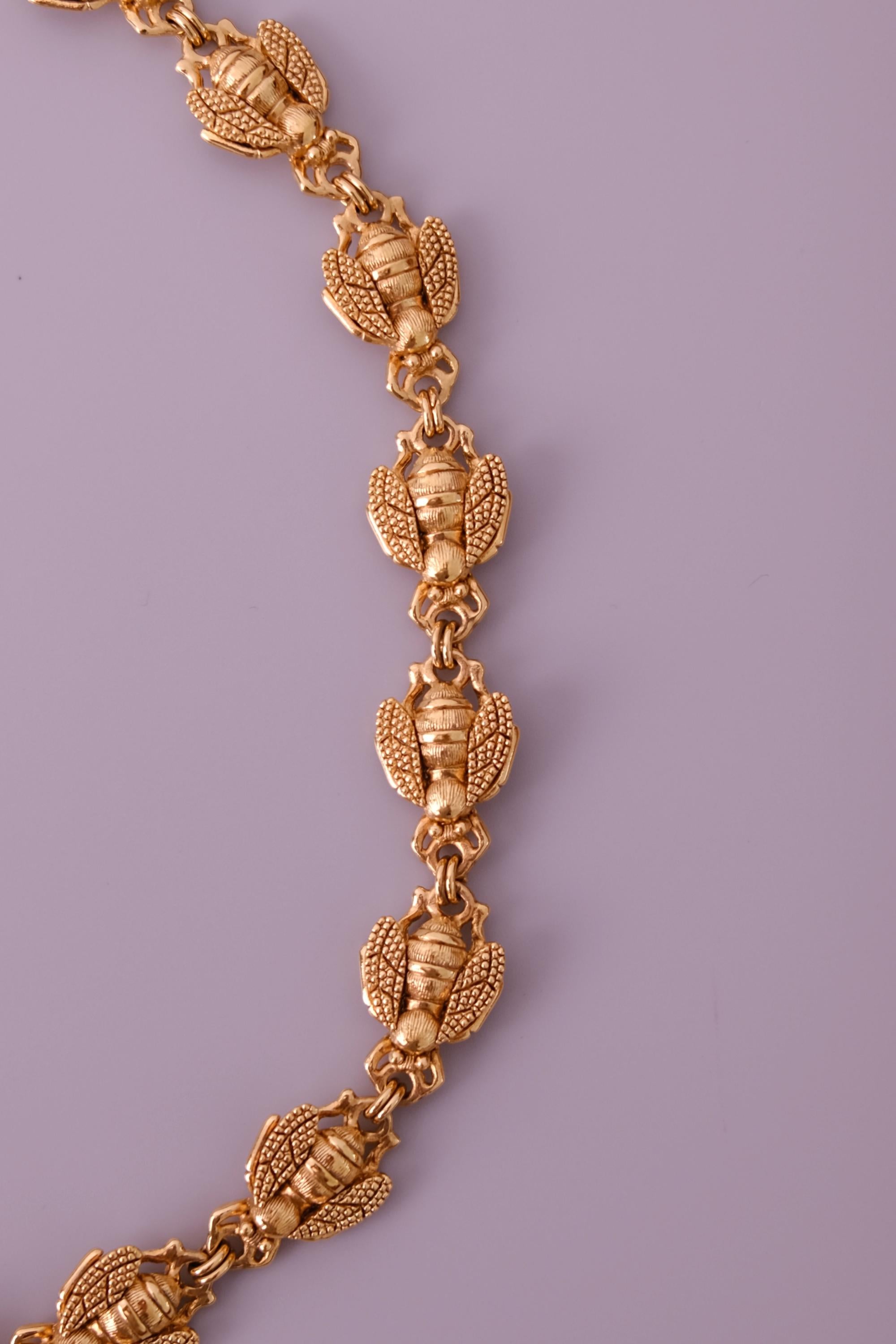Vintage Christian Dior gold-tone necklace featuring 19 sculptural bee motifs, signed Dior Germany