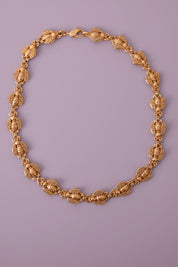 Vintage Christian Dior gold-tone necklace featuring 19 sculptural bee motifs, signed Dior Germany