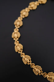 Vintage Christian Dior gold-tone necklace featuring 19 sculptural bee motifs, signed Dior Germany