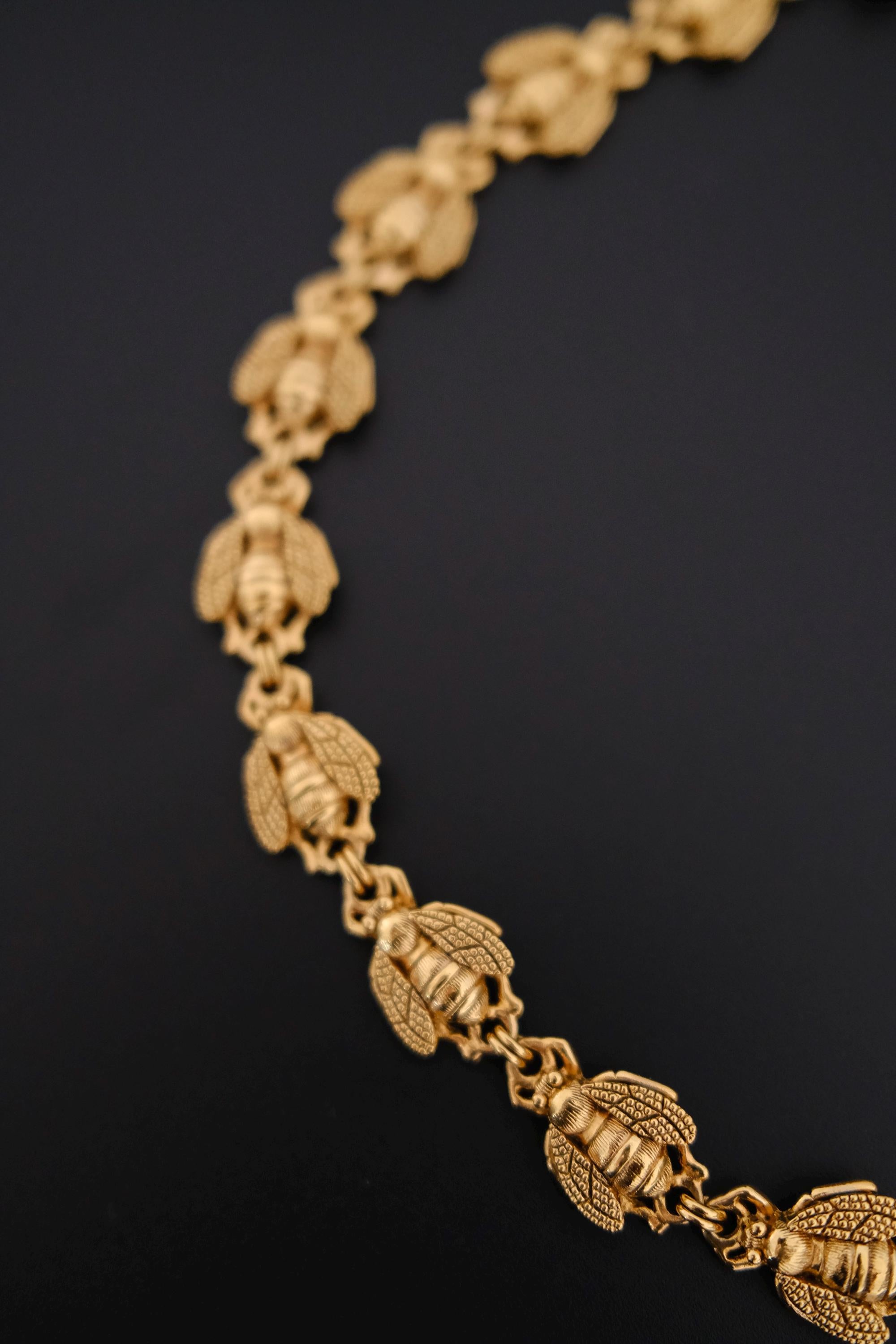Vintage Christian Dior gold-tone necklace featuring 19 sculptural bee motifs, signed Dior Germany
