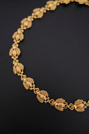 Vintage Christian Dior gold-tone necklace featuring 19 sculptural bee motifs, signed Dior Germany