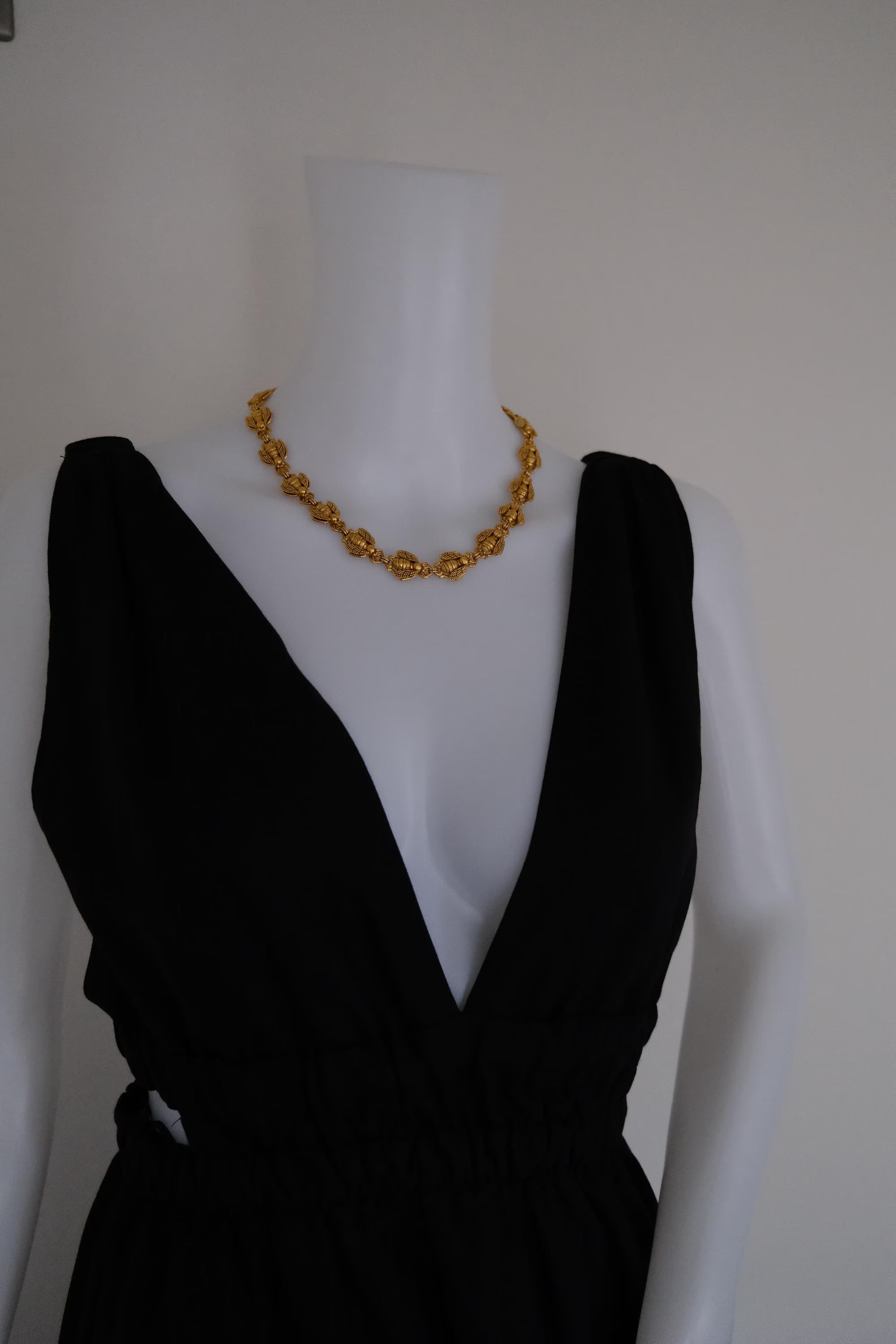 Vintage Christian Dior gold-tone necklace featuring 19 sculptural bee motifs, signed Dior Germany