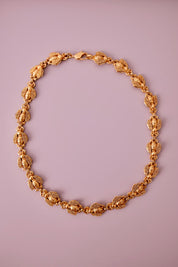 Vintage Christian Dior gold-tone necklace featuring 19 sculptural bee motifs, signed Dior Germany