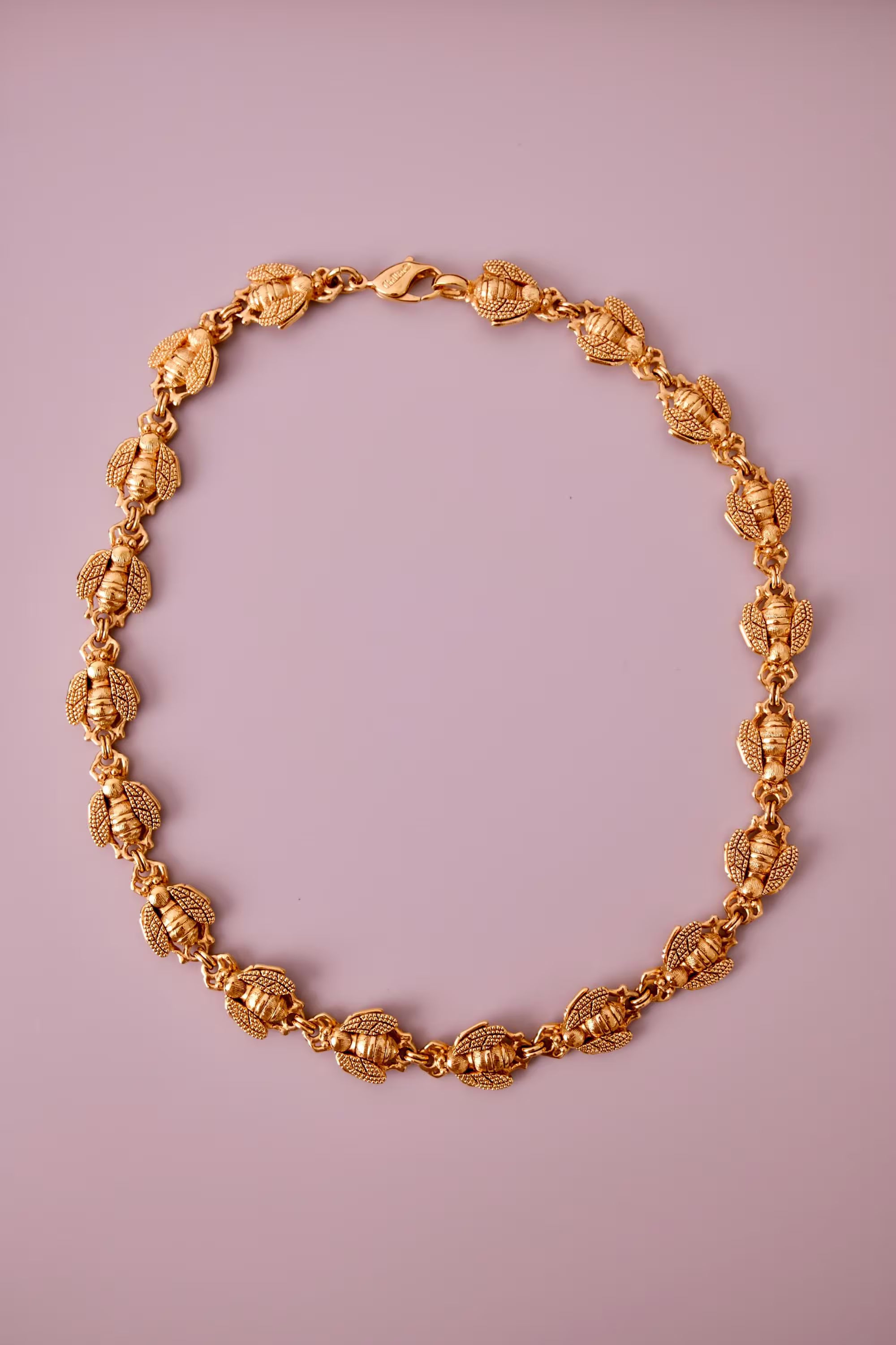 Vintage Christian Dior gold-tone necklace featuring 19 sculptural bee motifs, signed Dior Germany
