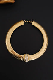 Vintage Christian Dior gold-tone Tubogas-style choker necklace with crystal centerpiece, signed Chr. Dior and made in Germany