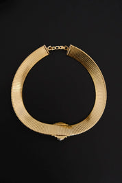 Vintage Christian Dior gold-tone Tubogas-style choker necklace with crystal centerpiece, signed Chr. Dior and made in Germany