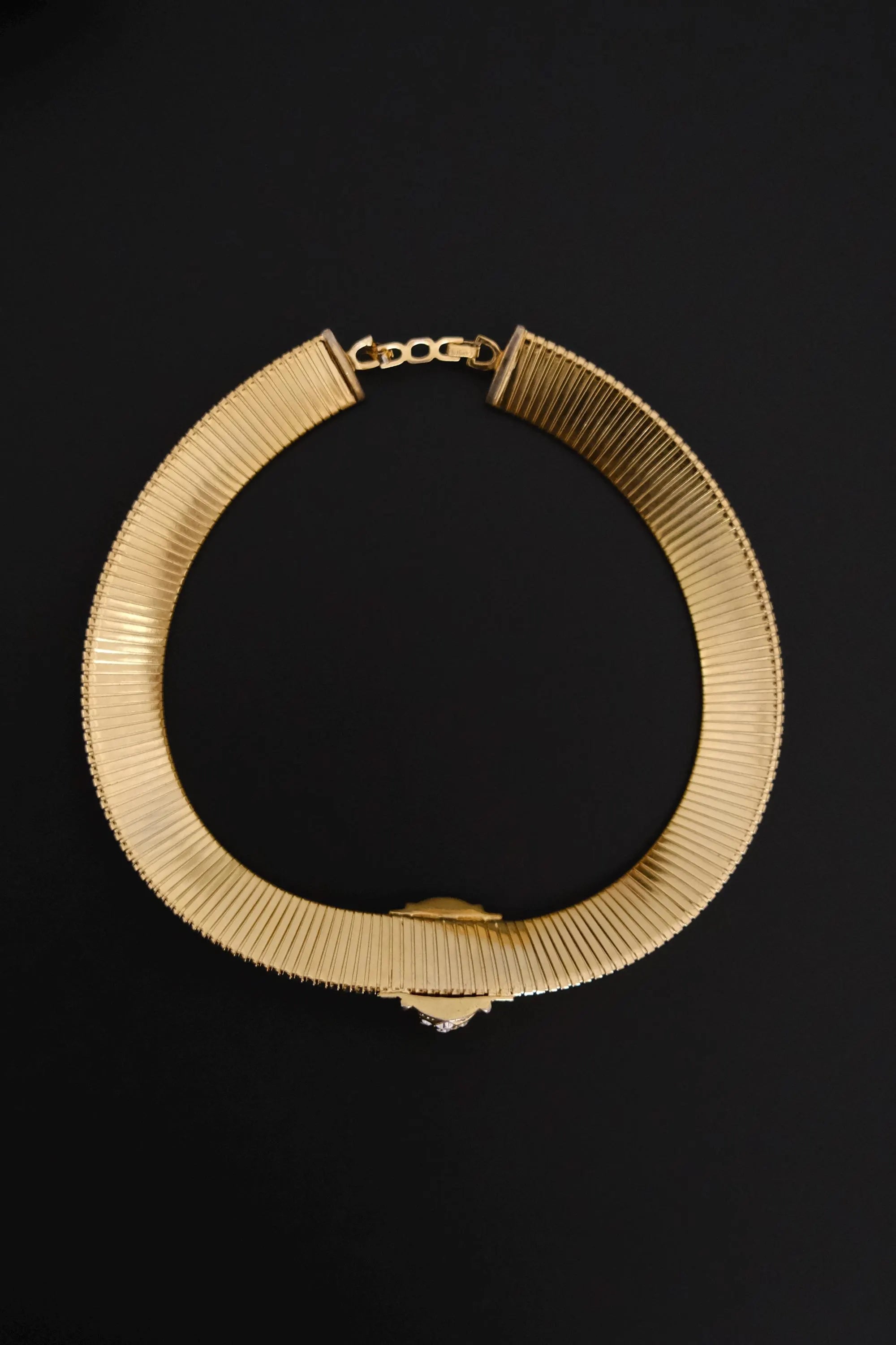 Vintage Christian Dior gold-tone Tubogas-style choker necklace with crystal centerpiece, signed Chr. Dior and made in Germany