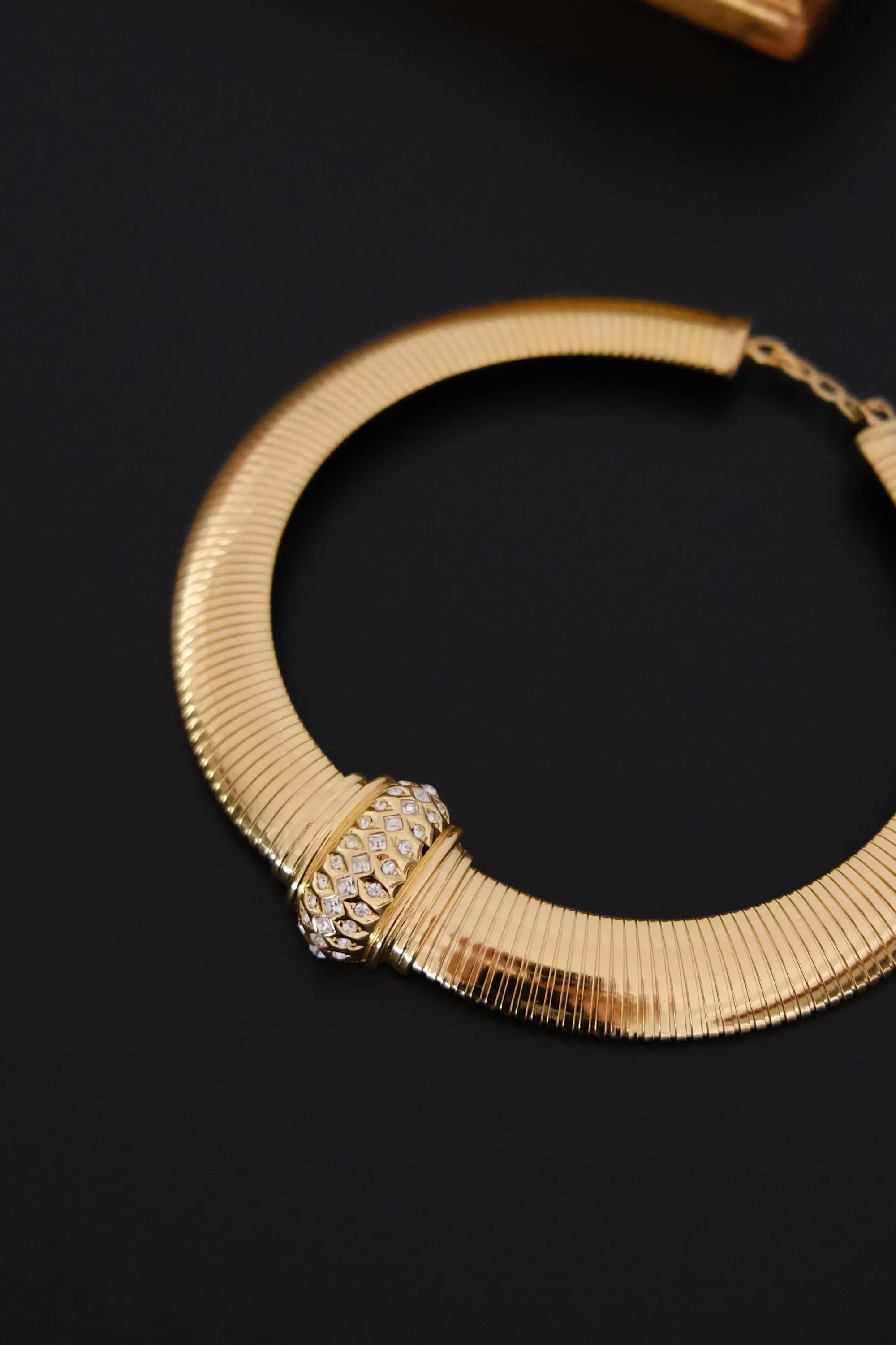 Vintage Christian Dior gold-tone Tubogas-style choker necklace with crystal centerpiece, signed Chr. Dior and made in Germany