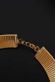 Vintage Christian Dior gold-tone Tubogas-style choker necklace with crystal centerpiece, signed Chr. Dior and made in Germany