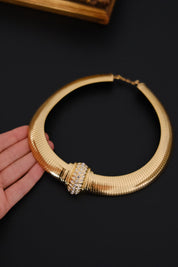 Vintage Christian Dior gold-tone Tubogas-style choker necklace with crystal centerpiece, signed Chr. Dior and made in Germany