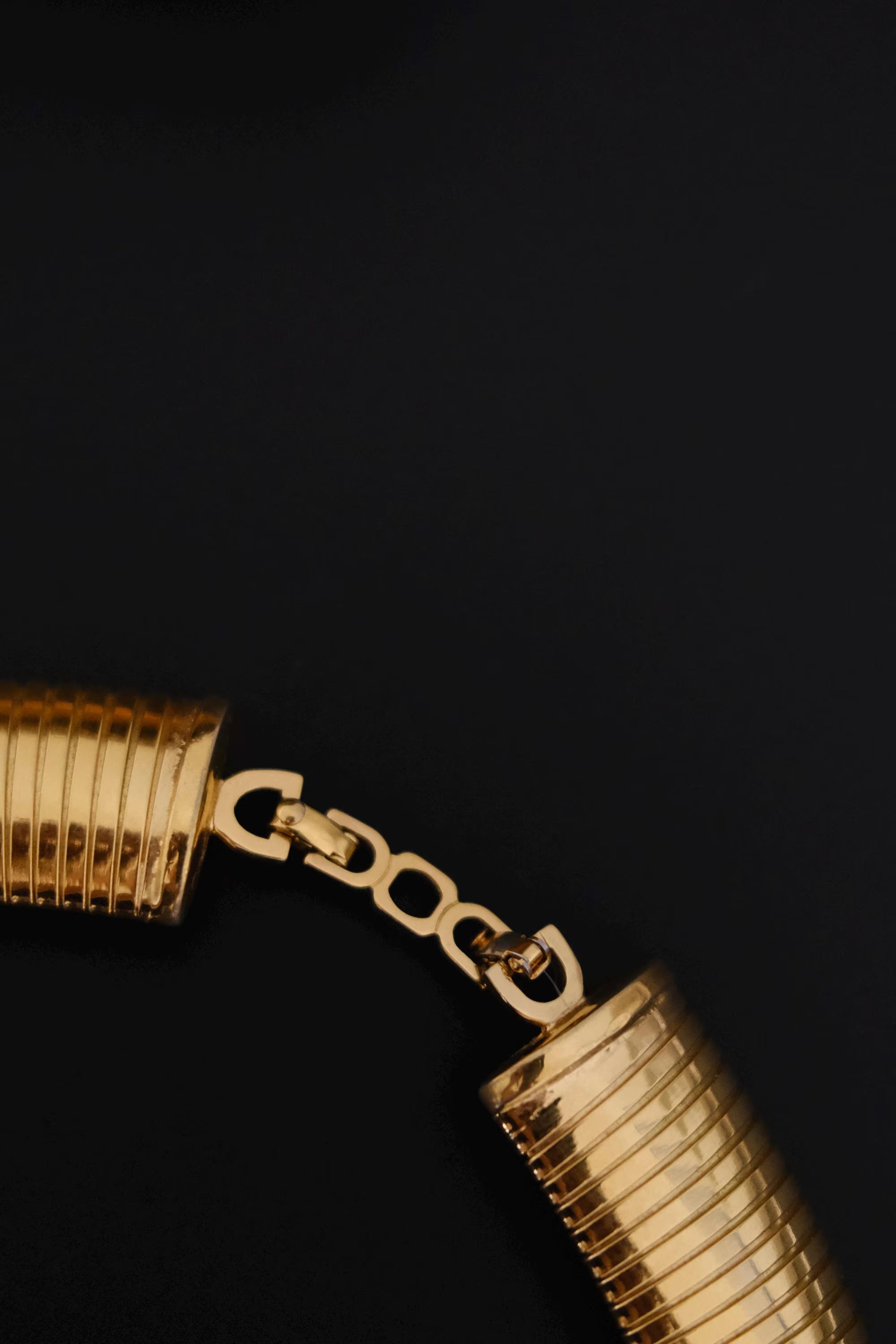 Vintage Christian Dior gold-tone Tubogas-style choker necklace with crystal centerpiece, signed Chr. Dior and made in Germany
