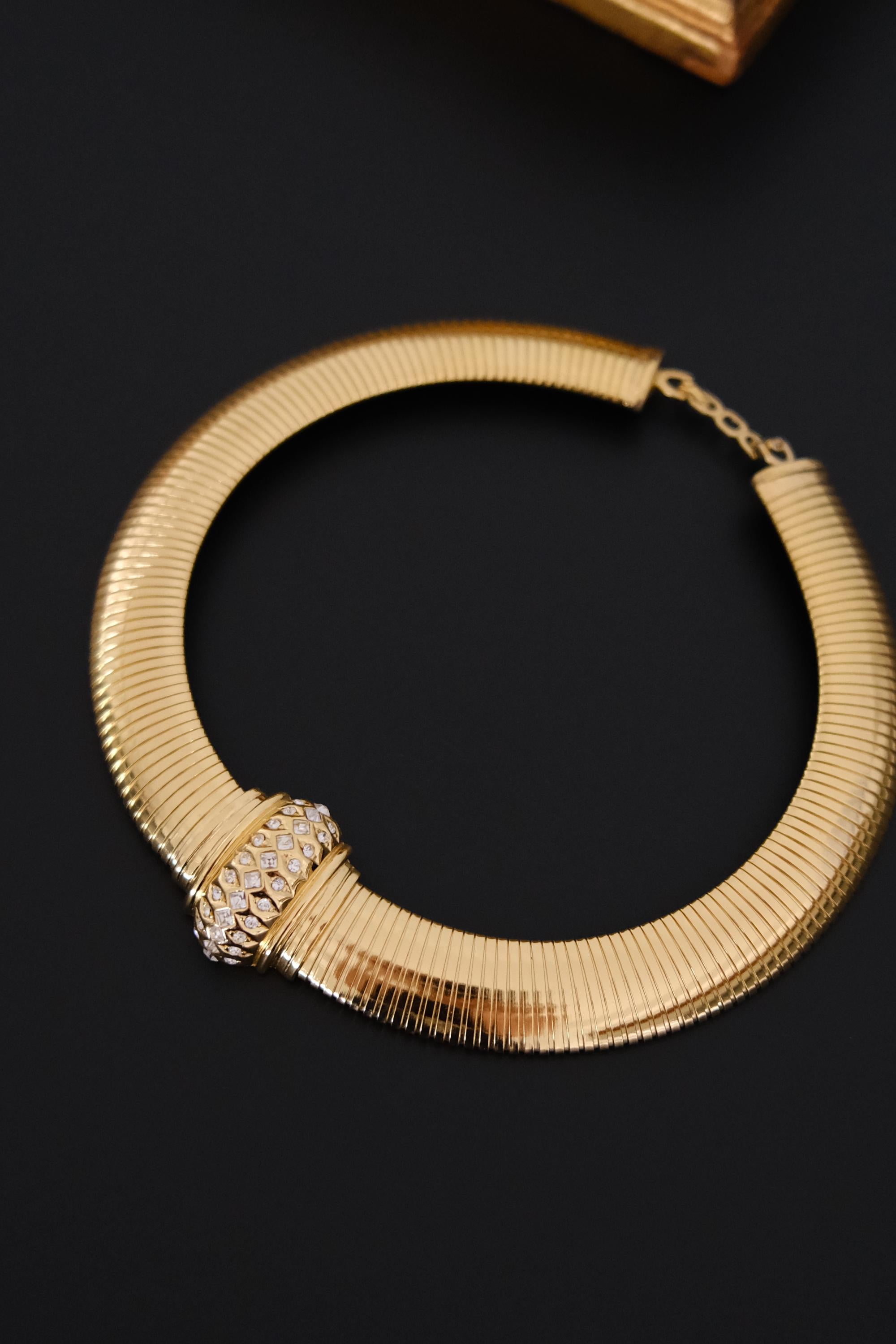 Vintage Christian Dior gold-tone Tubogas-style choker necklace with crystal centerpiece, signed Chr. Dior and made in Germany
