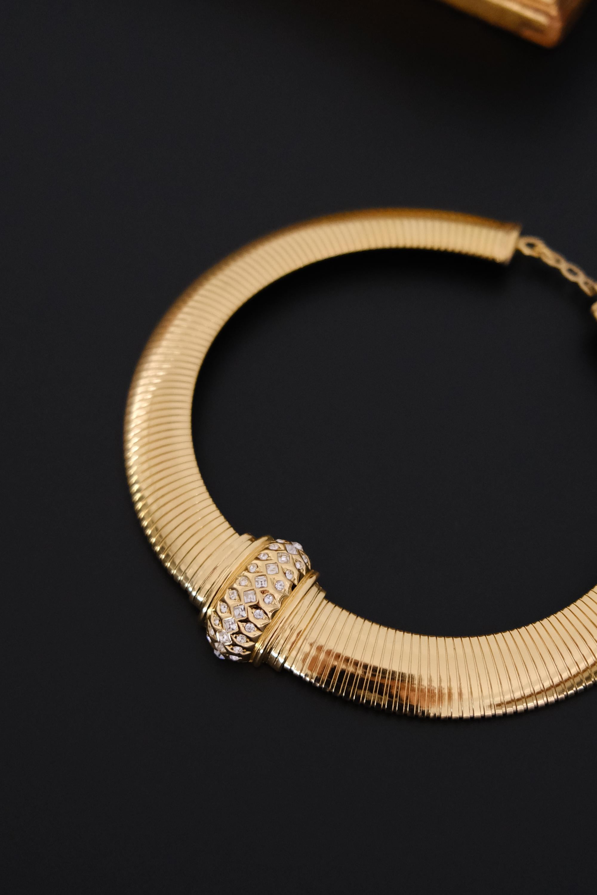 Vintage Christian Dior gold-tone Tubogas-style choker necklace with crystal centerpiece, signed Chr. Dior and made in Germany