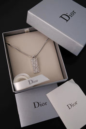 Vintage Christian Dior reversible monogram crystal pendant necklace in silver-tone metal with Dior box