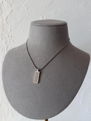 Excellent vintage condition Christian Dior silver-tone monogram and crystal pendant necklace