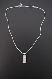 Full view of vintage Christian Dior reversible rectangular pendant necklace with silver-tone snake chain