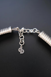 Close-up of adjustable clasp and extension chain on vintage Christian Dior silver-tone Tubogas choker