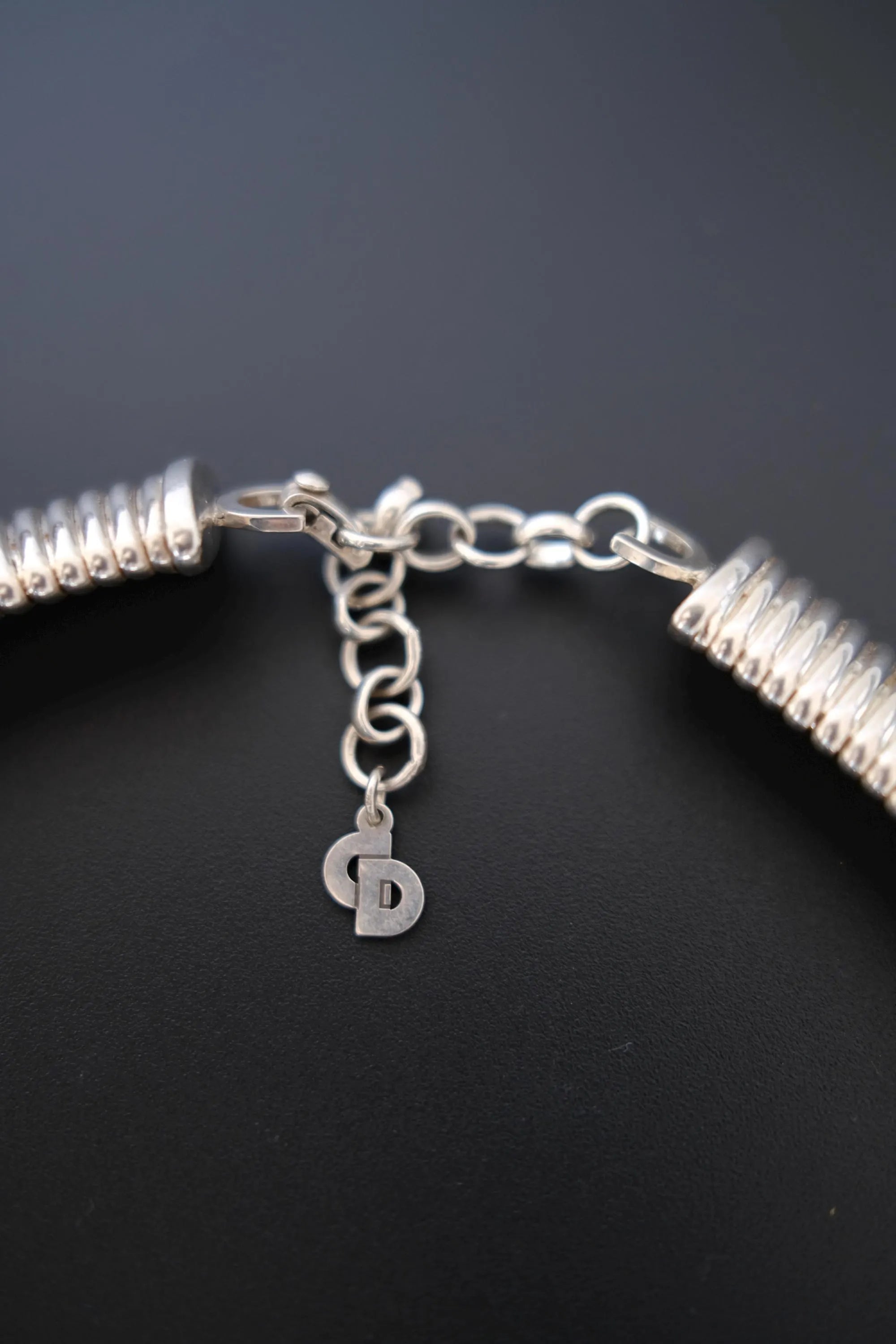 Close-up of adjustable clasp and extension chain on vintage Christian Dior silver-tone Tubogas choker