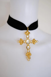 Vintage Christian Lacroix baroque gold cross necklace styled with an elegant  dress