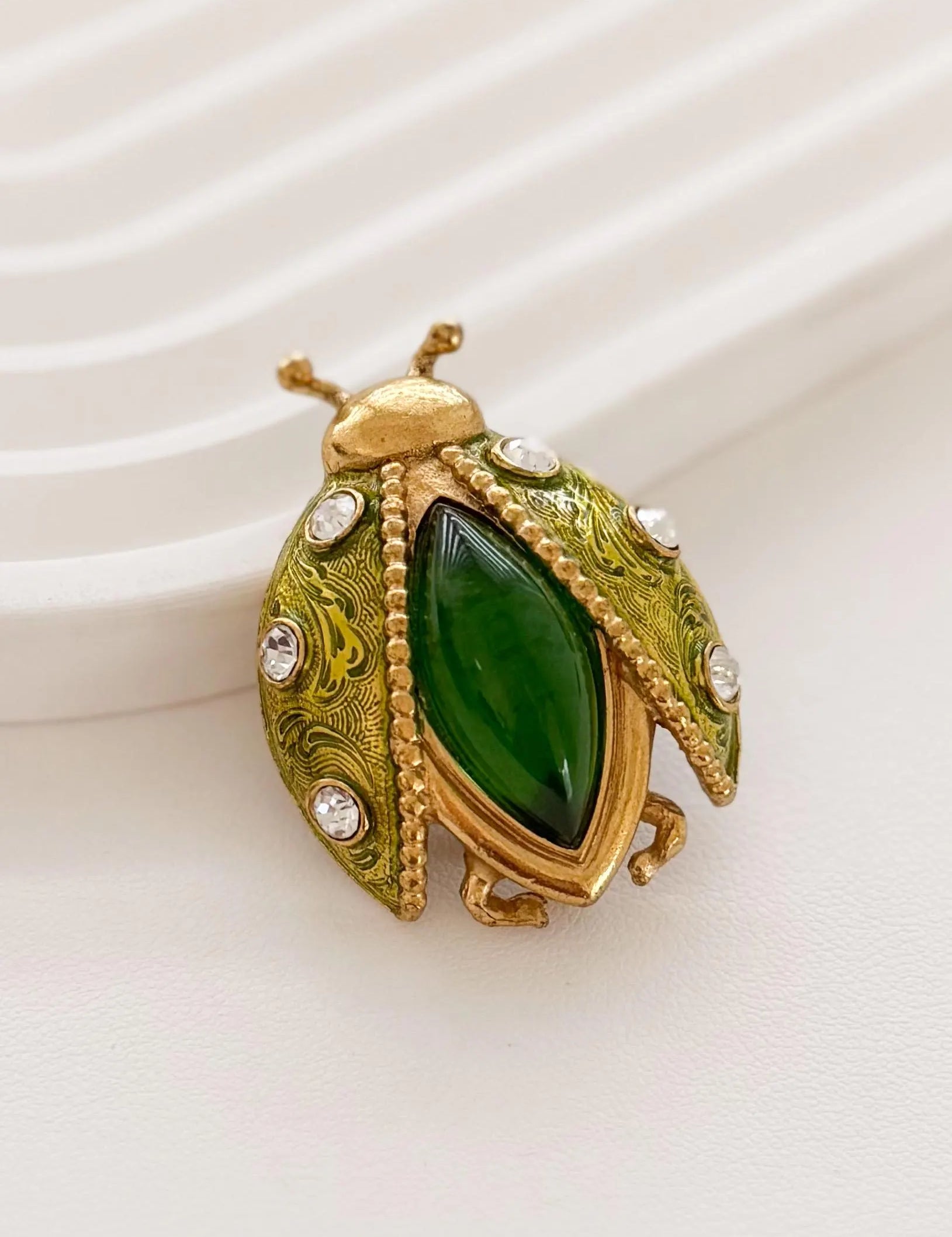 Elegant vintage Dior beetle brooch gold rhinestone symbolic refined luxury jewelry