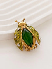 Elegant vintage Dior beetle brooch gold rhinestone symbolic refined luxury jewelry