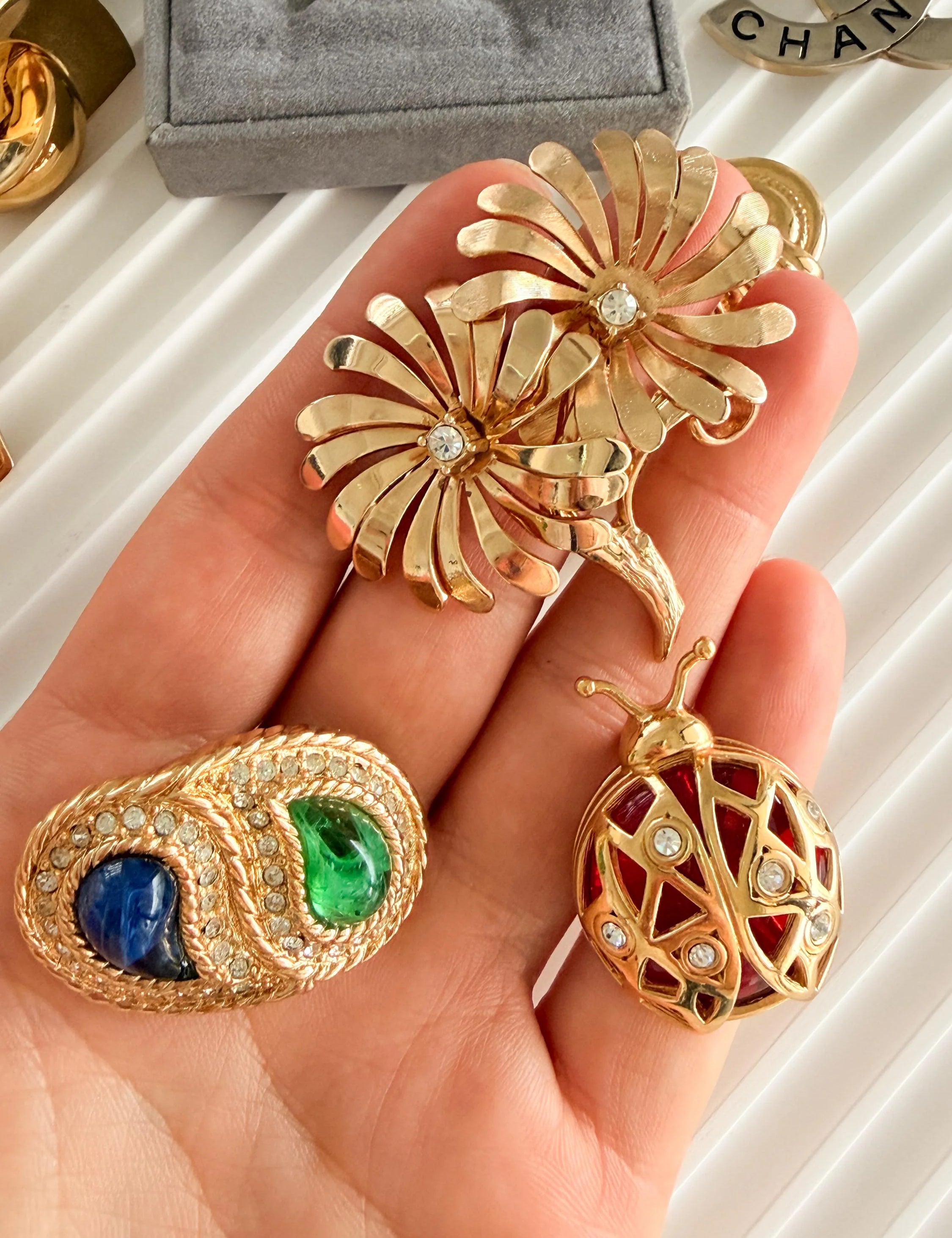 Vintage Dior gold brooch with blue green cabochon refined elegant designer jewelry
