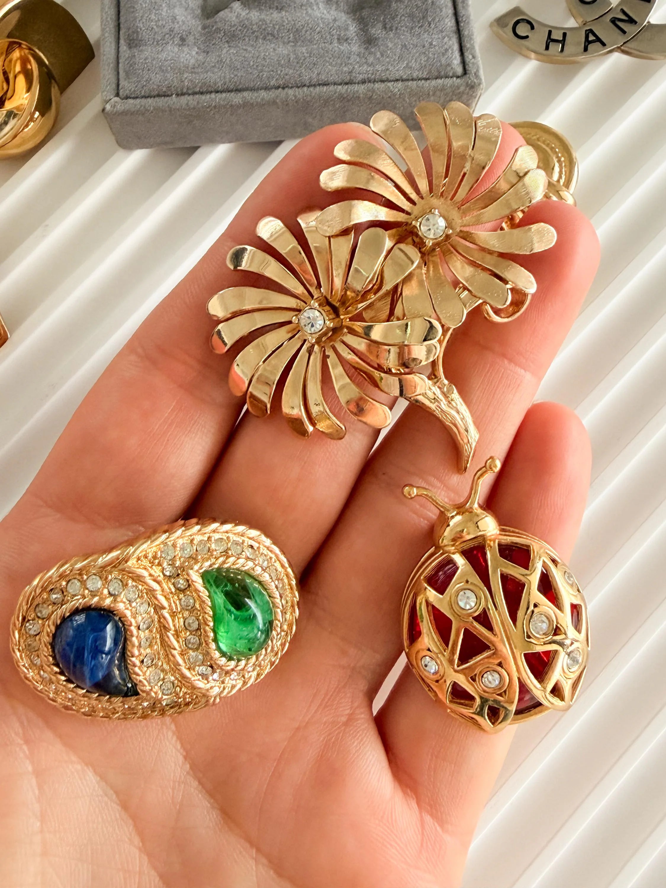 Vintage Dior gold brooch with blue green cabochon refined elegant designer jewelry
