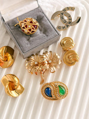 Elegant vintage Dior gold brooch with blue green cabochon and rhinestones timeless luxury