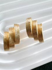 Vintage Dior earrings, Christian Dior jewelry, gold-tone clip-on earrings, designer statement earrings, 1980s Dior jewelry