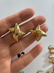 Vintage Givenchy earrings, gold-plated clip-on earrings, 1980s designer jewelry, sculptural statement earrings, Givenchy logo earrings