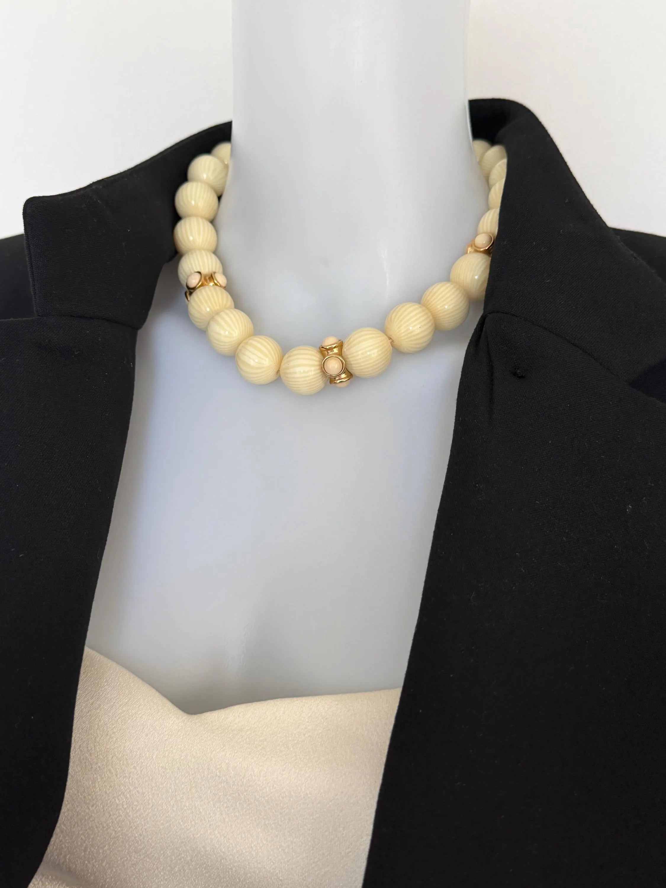 Vintage Givenchy cream and gold-tone statement necklace styled with a tailored blazer