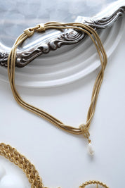 Vintage Givenchy gold faux pearl drop necklace with signed pendant elegant designer jewelry