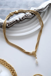 Vintage Givenchy gold faux pearl drop necklace with signed pendant elegant designer jewelry