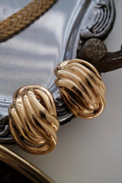 Elegant vintage Givenchy gold knot clip on earrings timeless luxury for sophisticated women