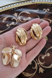 Elegant vintage Givenchy gold knot clip on earrings timeless luxury for sophisticated women