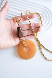 Givenchy long chain pendant necklace on neck refined statement style
