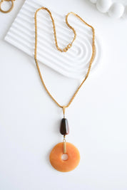 Vintage Givenchy necklace styled with outfit 70s chic luxury look