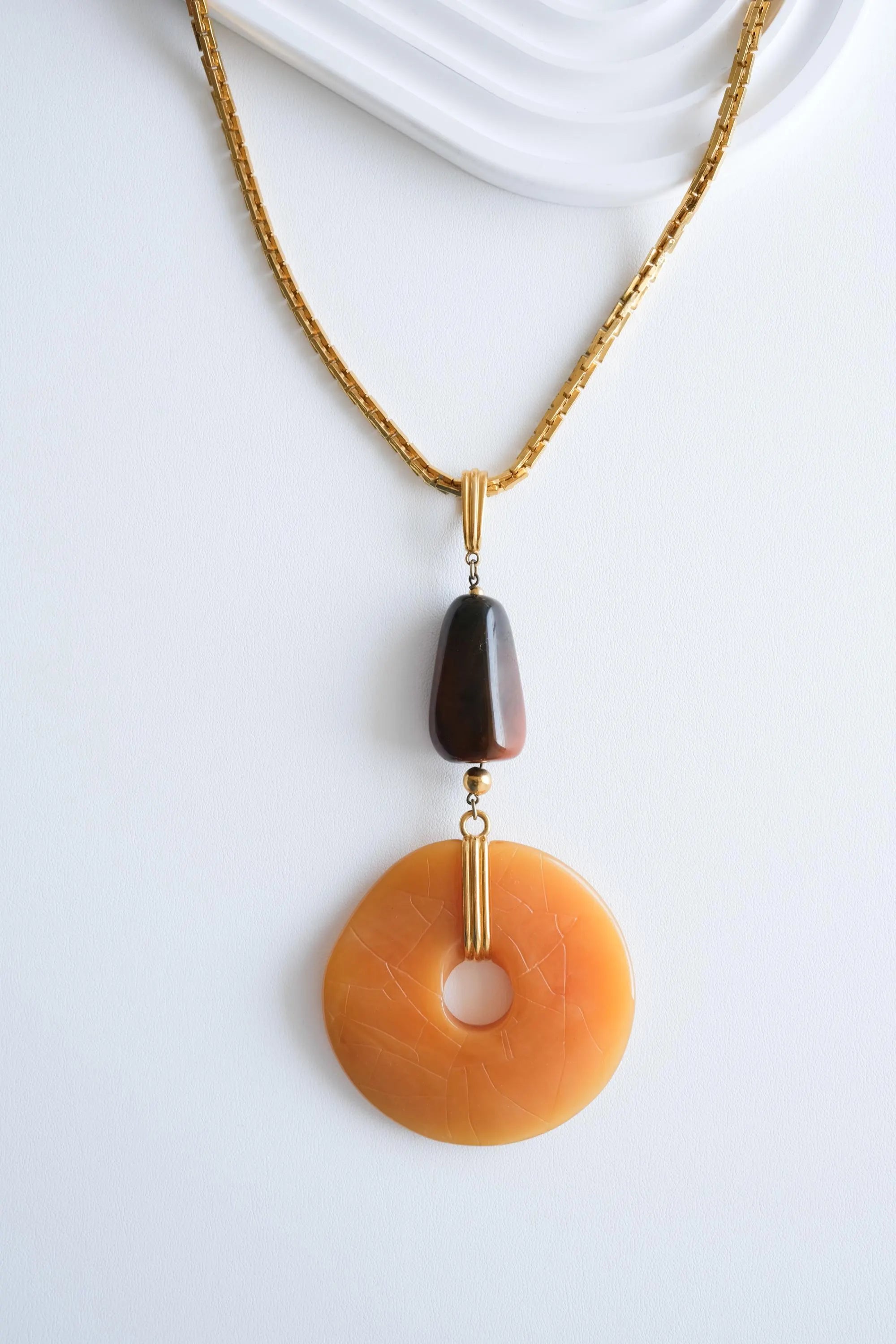 Vintage Givenchy necklace styled with outfit 70s chic luxury look