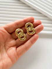 Elegant vintage Givenchy gold rope clip on earrings refined timeless luxury jewelry