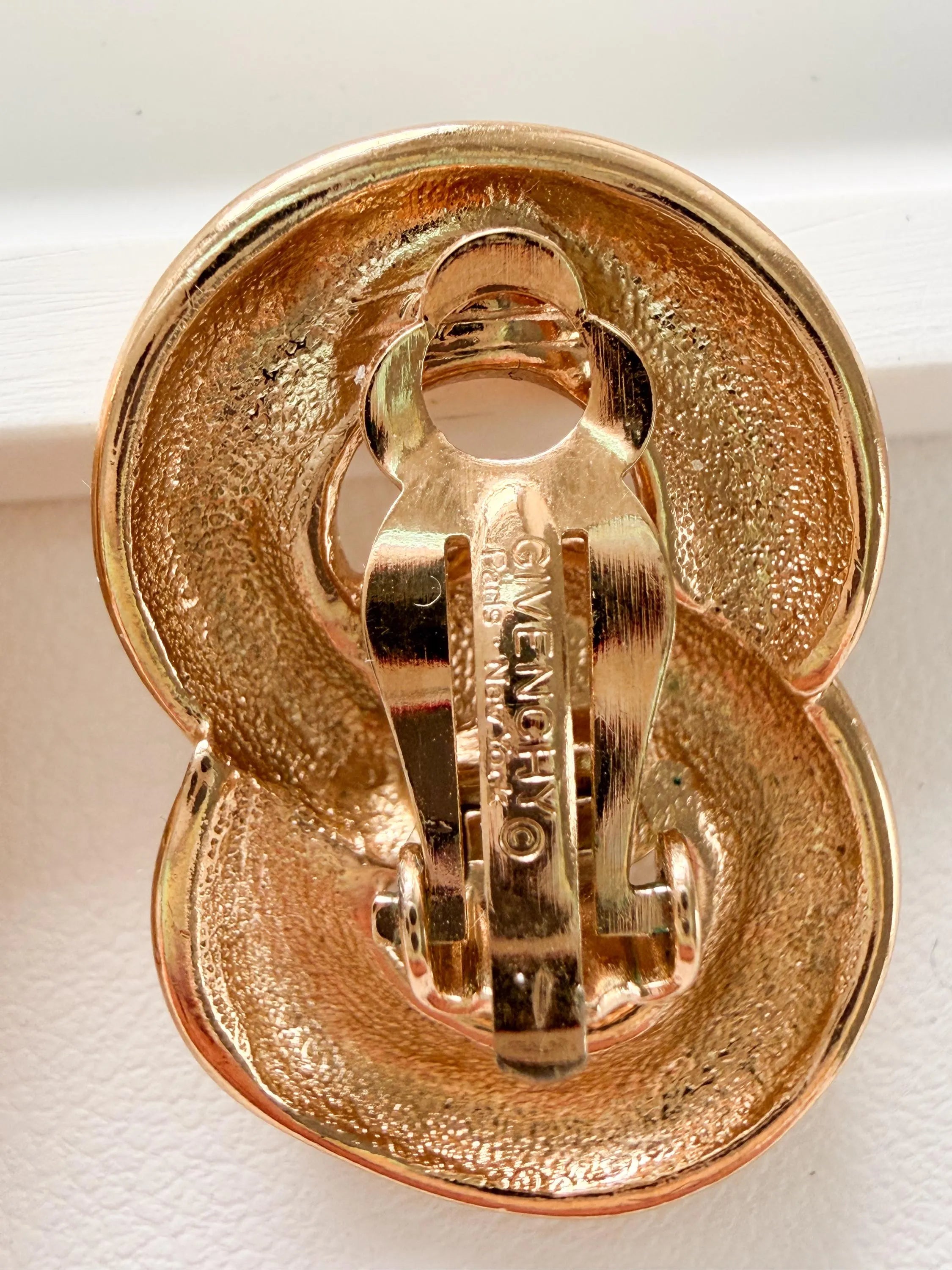 
Givenchy vintage gold rope earrings clip on sophisticated luxury accessory