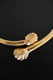 Close-up of sculptural fluted shell-shaped terminals on vintage Givenchy gold-tone choker