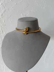 Vintage Givenchy gold-tone shell collar necklace worn closely around the neckline