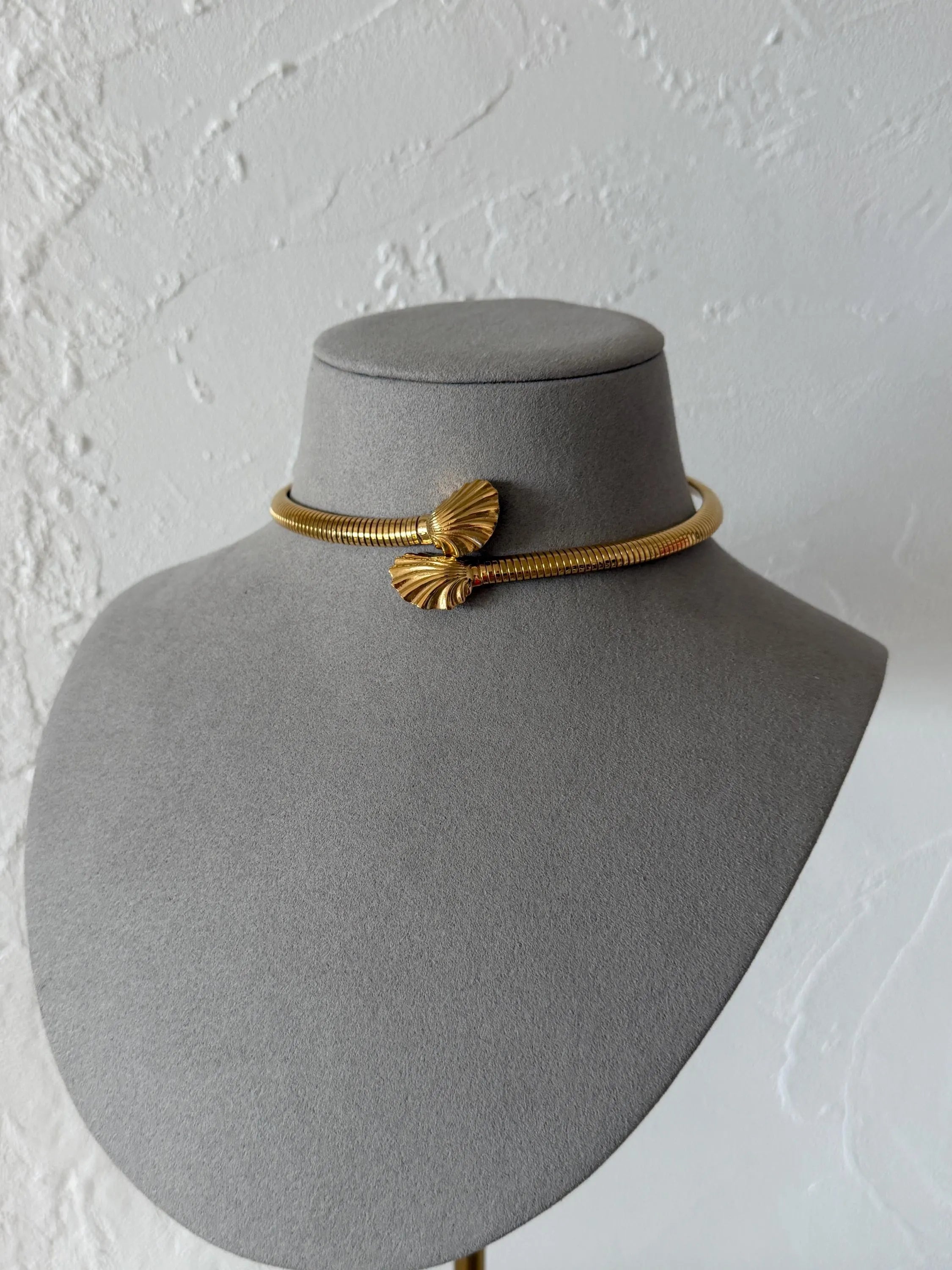 Vintage Givenchy gold-tone shell collar necklace worn closely around the neckline