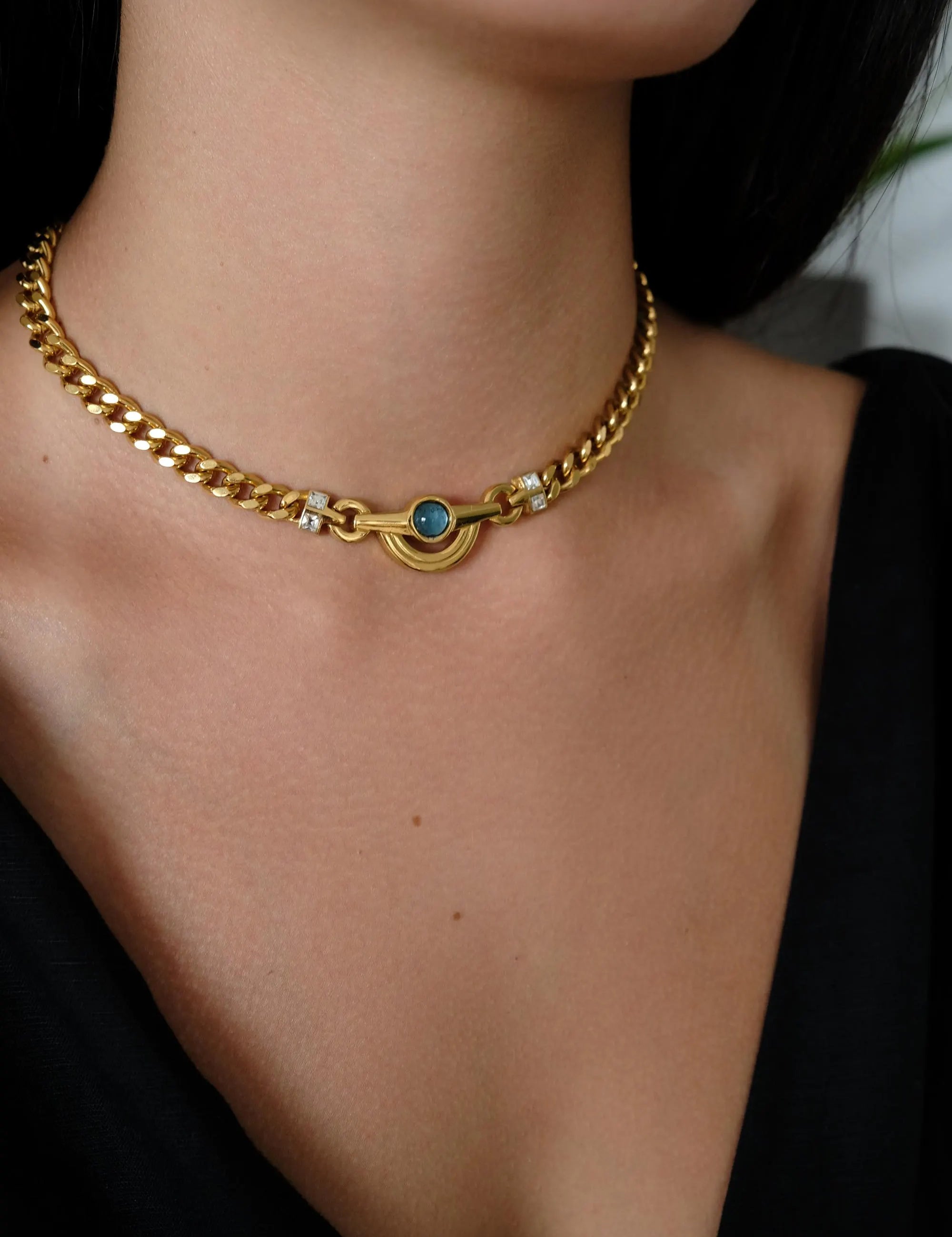 Vintage_Givenchy_Necklace_Gold_Tone_Curb_Chain_with_Light_Blue_Cabochon_Crystal_Accents_1.webp