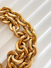 Vintage Givenchy Paris New York heart charm bracelet featuring a matte gold chunky chain, classic 1980s designer jewelry style, statement fashion accessory for women