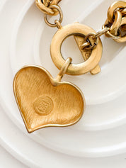 Vintage Givenchy Paris New York heart charm bracelet featuring a matte gold chunky chain, classic 1980s designer jewelry style, statement fashion accessory for women