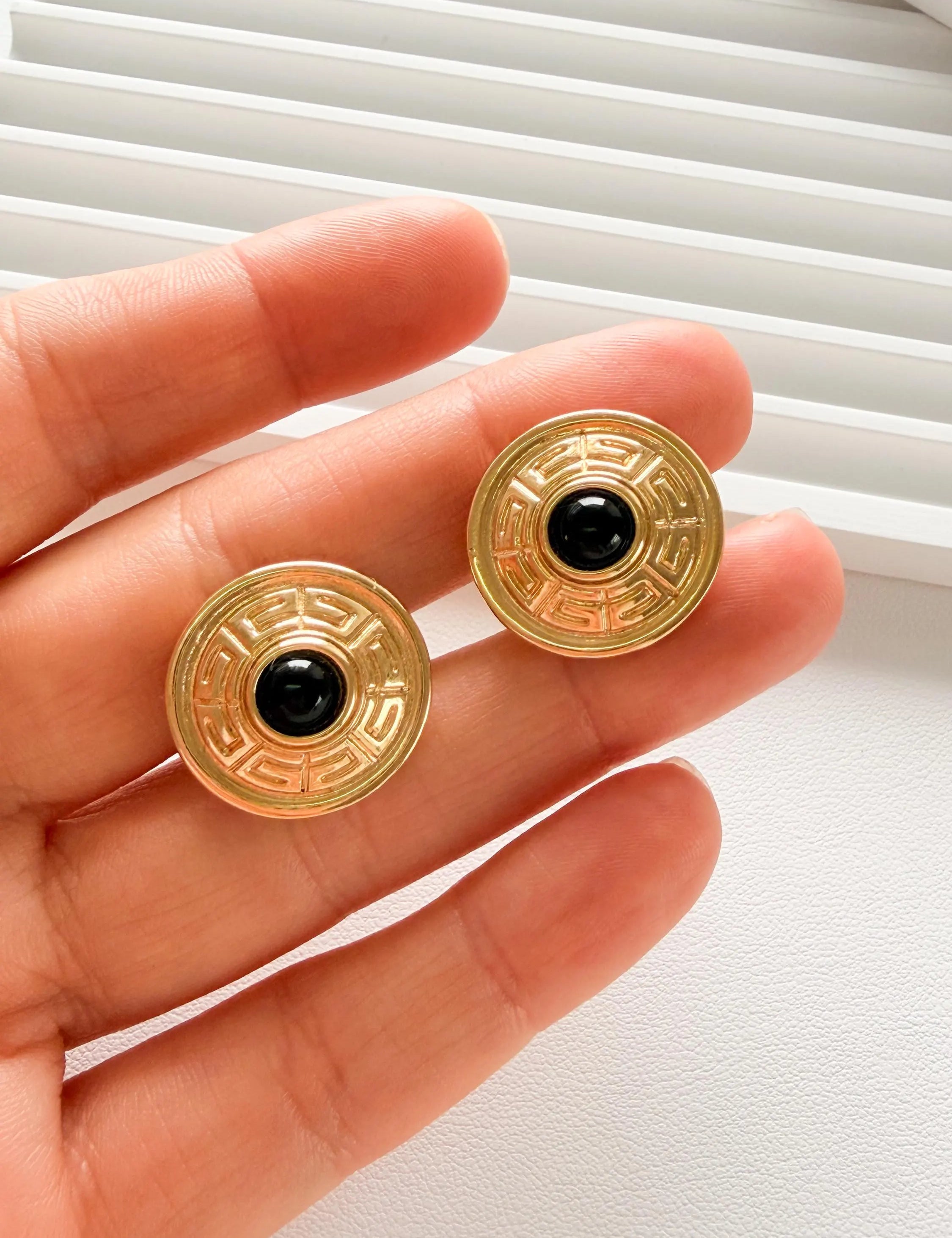 Elegant vintage Givenchy gold round clip on earrings refined timeless luxury jewelry, black cabochon